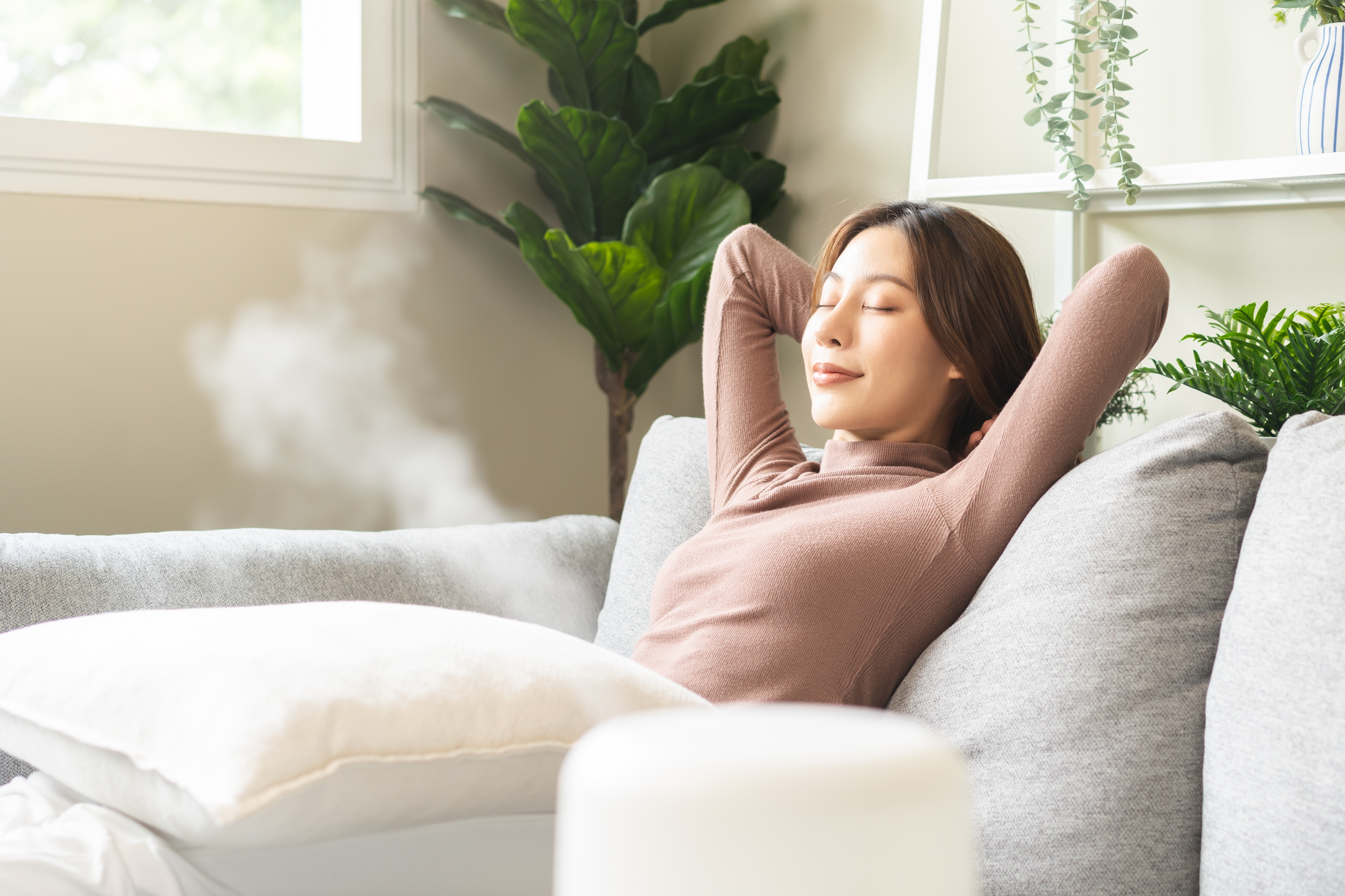Woman relaxing peacefully at home